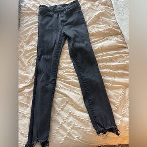 Abercrombie and Fitch black skinny jeans with distressed bottom. Size 25S.